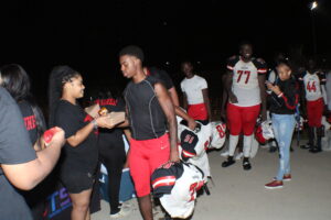 Raleigh Egypt High Youth Sports players leaving a football game